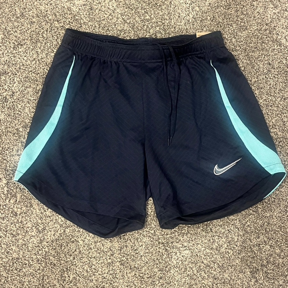 Nike Dark Blue Shorts with Light Blue/Aqua side Stripes (Women’s Small)